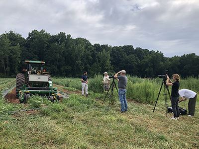 ACE members conduct video shoot in field. ACE members communicate message about agriculture and natural resources to various audiences.